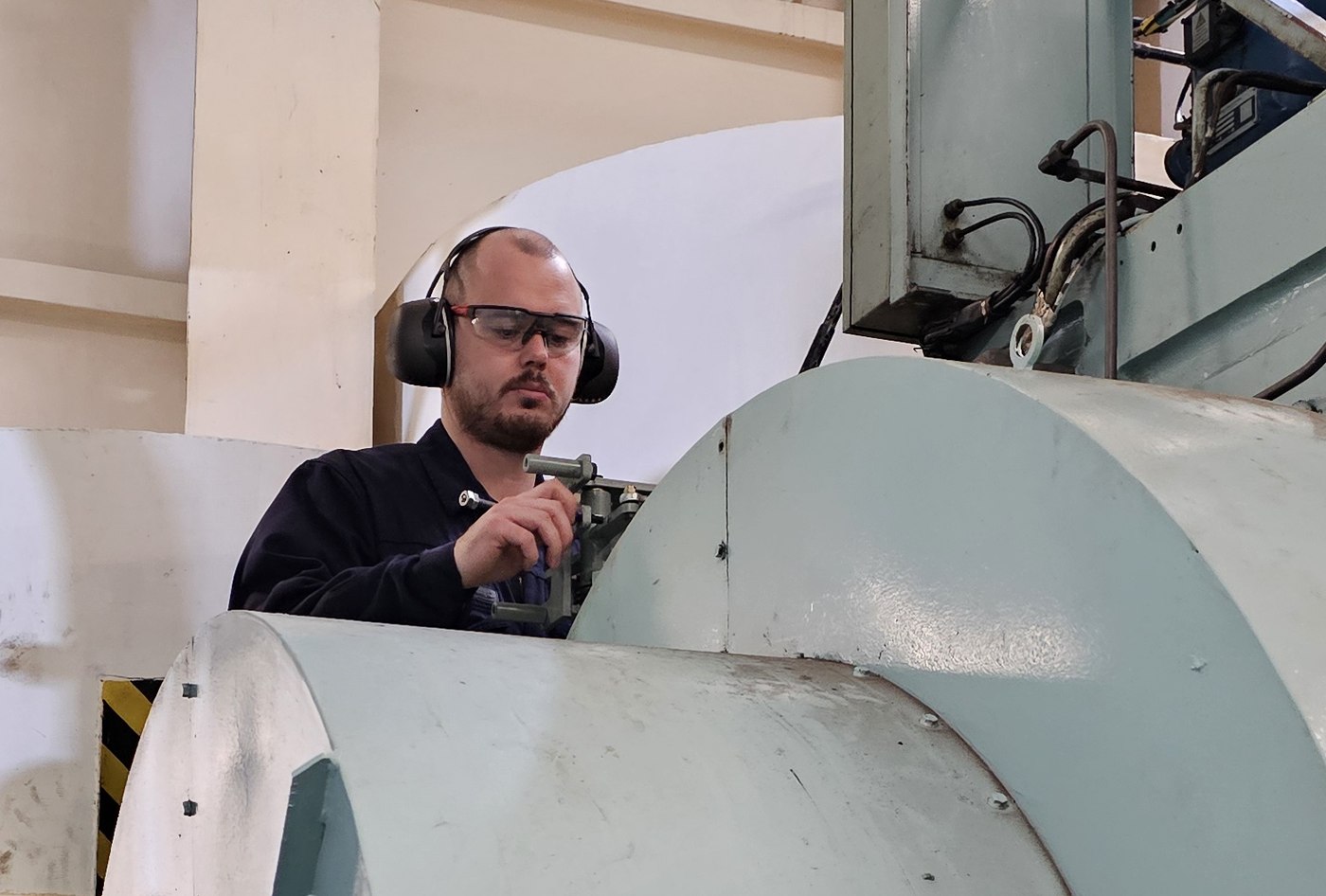 ME-Tech technician adjusting the engine onboard
